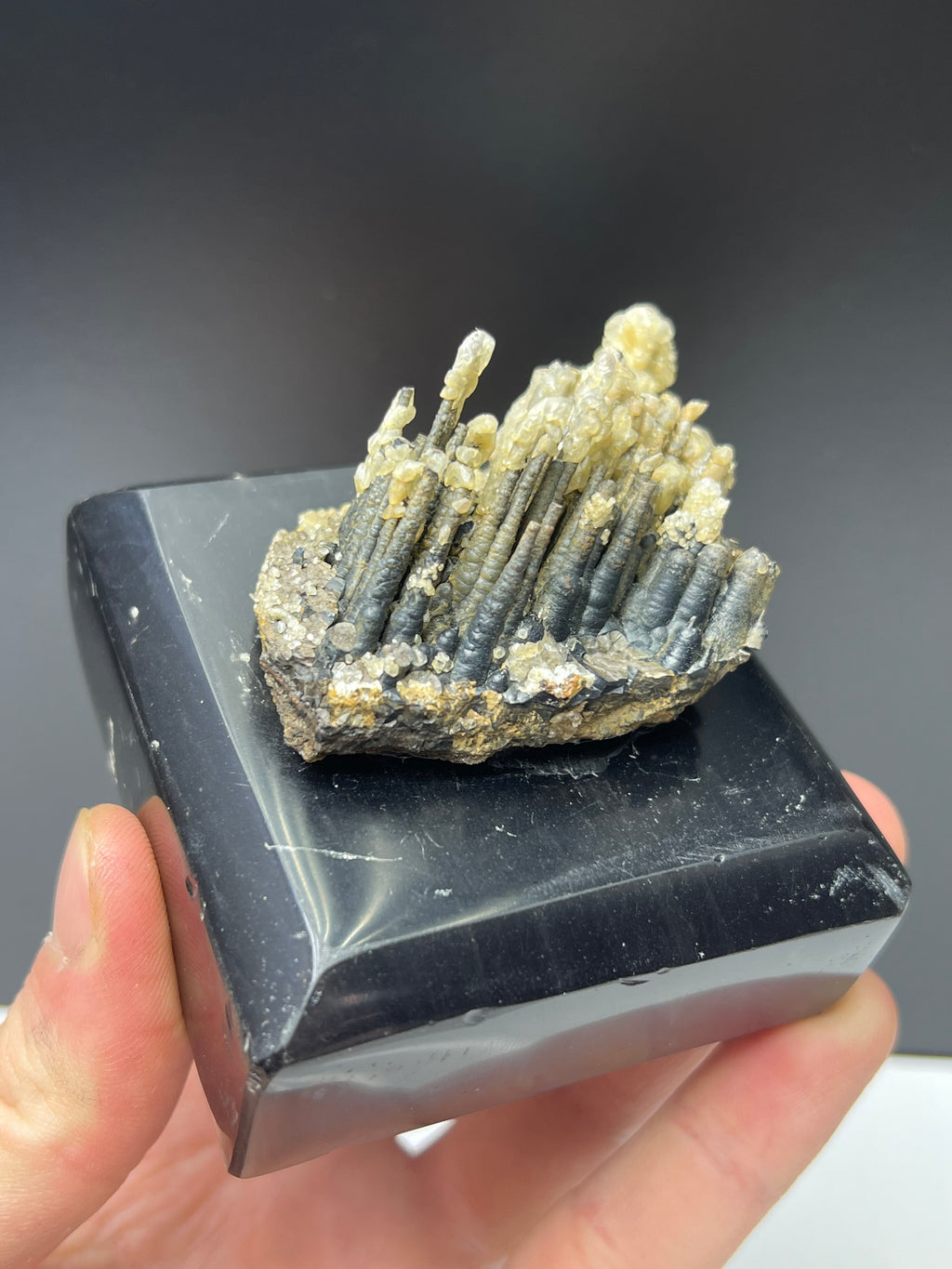 Calcite With Stalactite Goethite On Obsidian Stand