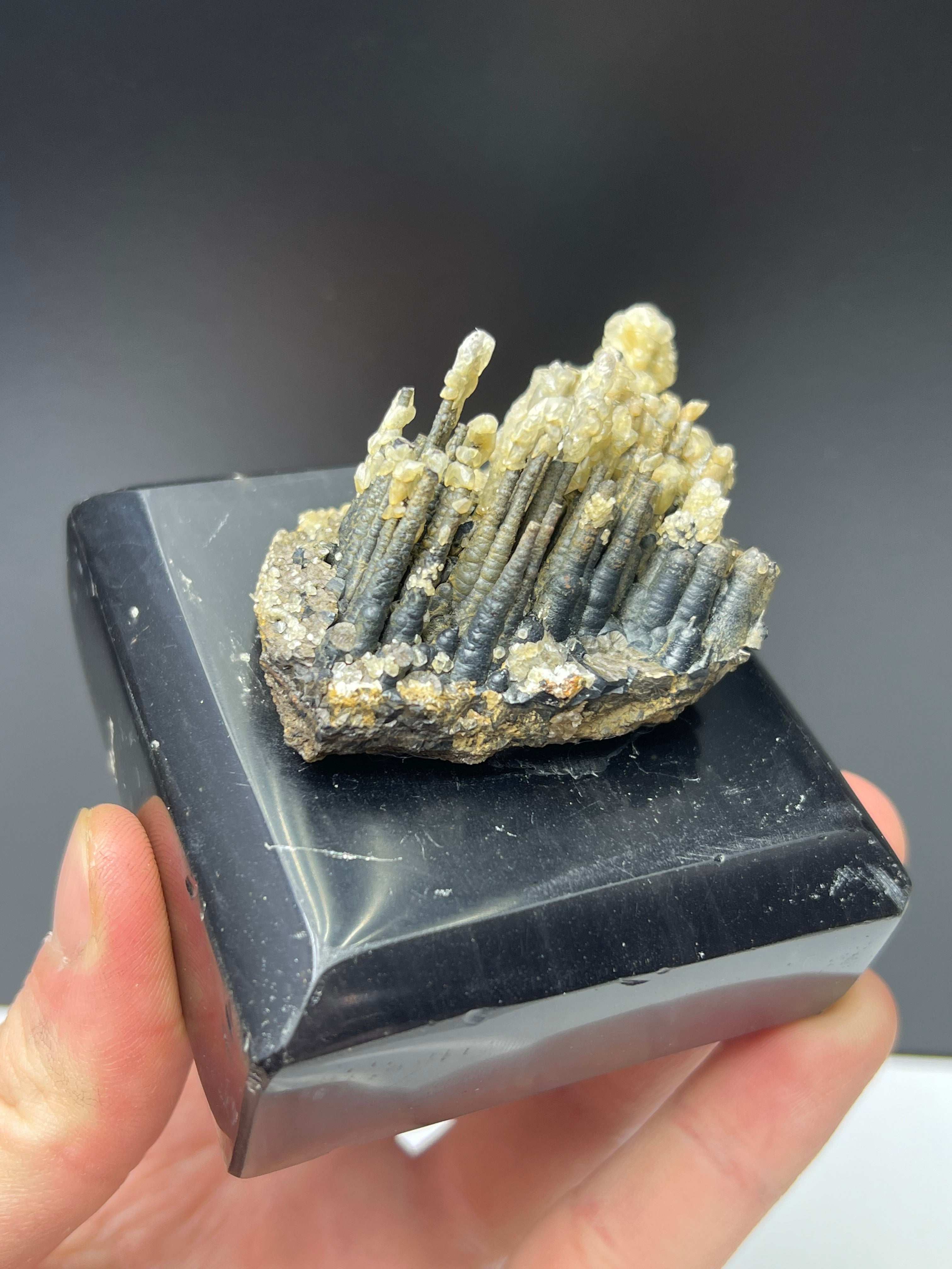 Calcite With Stalactite Goethite On Obsidian Stand