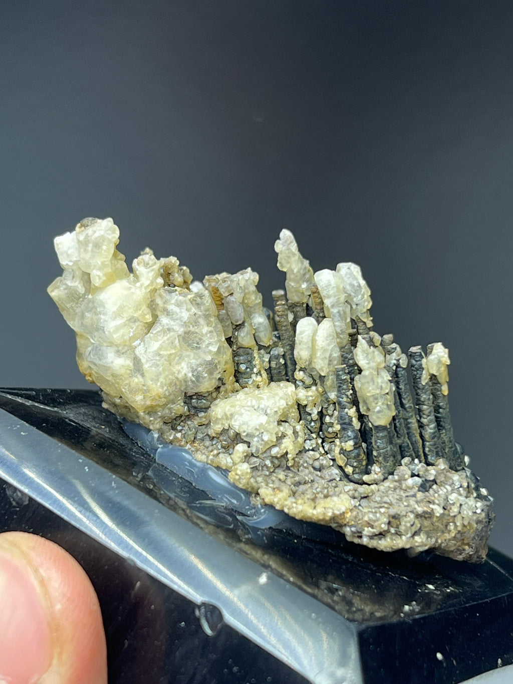 Calcite With Stalactite Goethite On Obsidian Stand