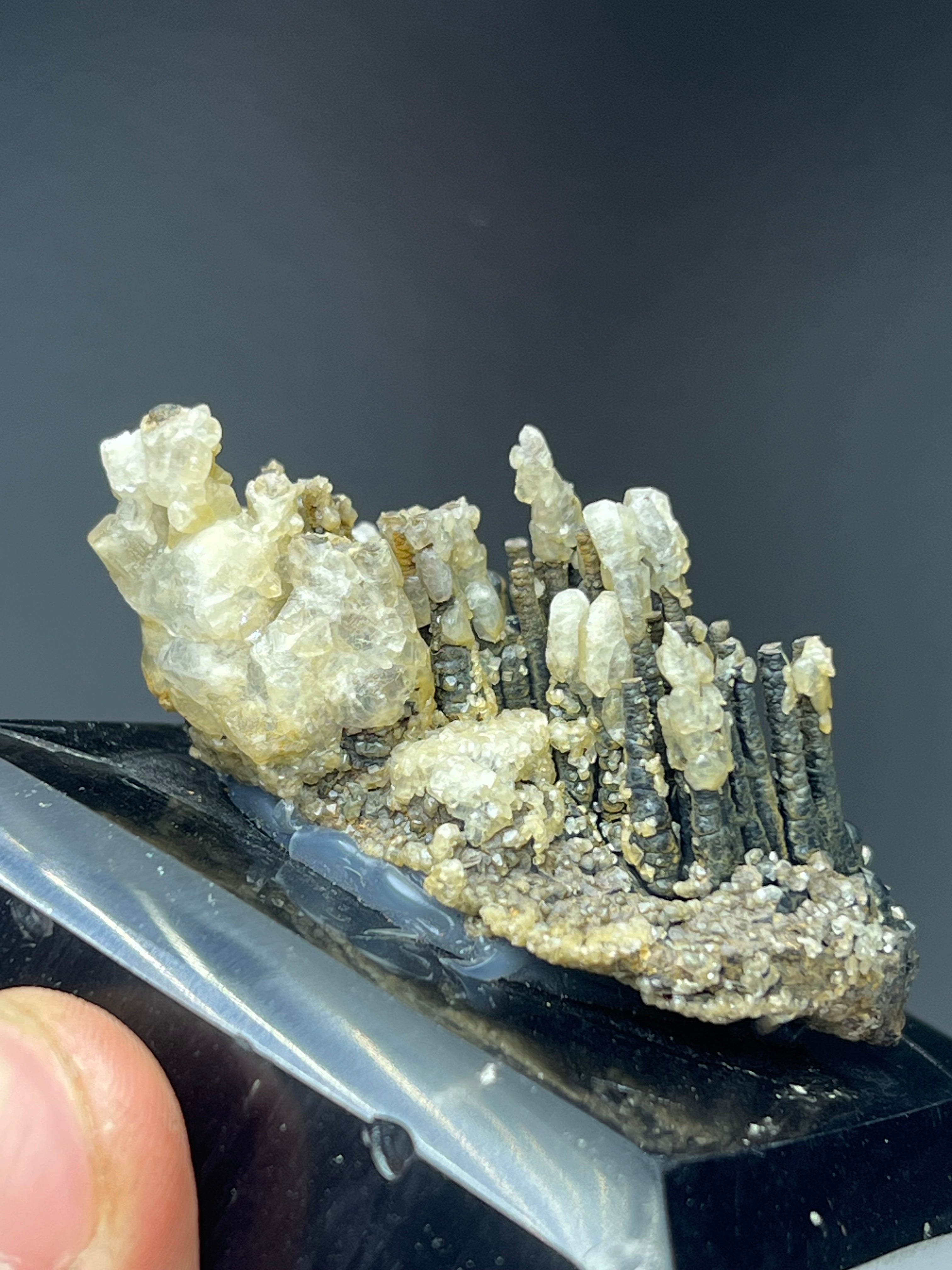 Calcite With Stalactite Goethite On Obsidian Stand
