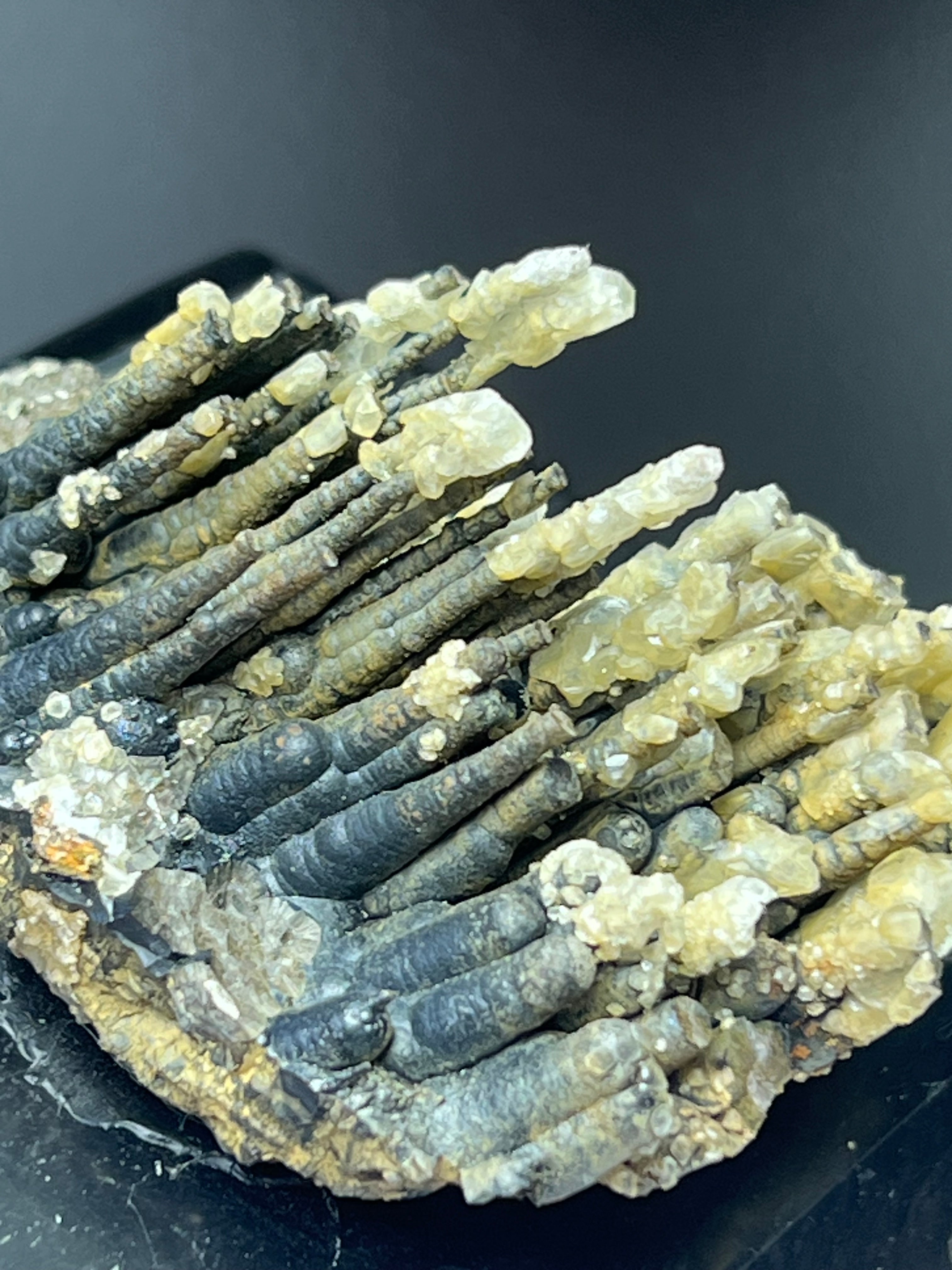 Calcite With Stalactite Goethite On Obsidian Stand