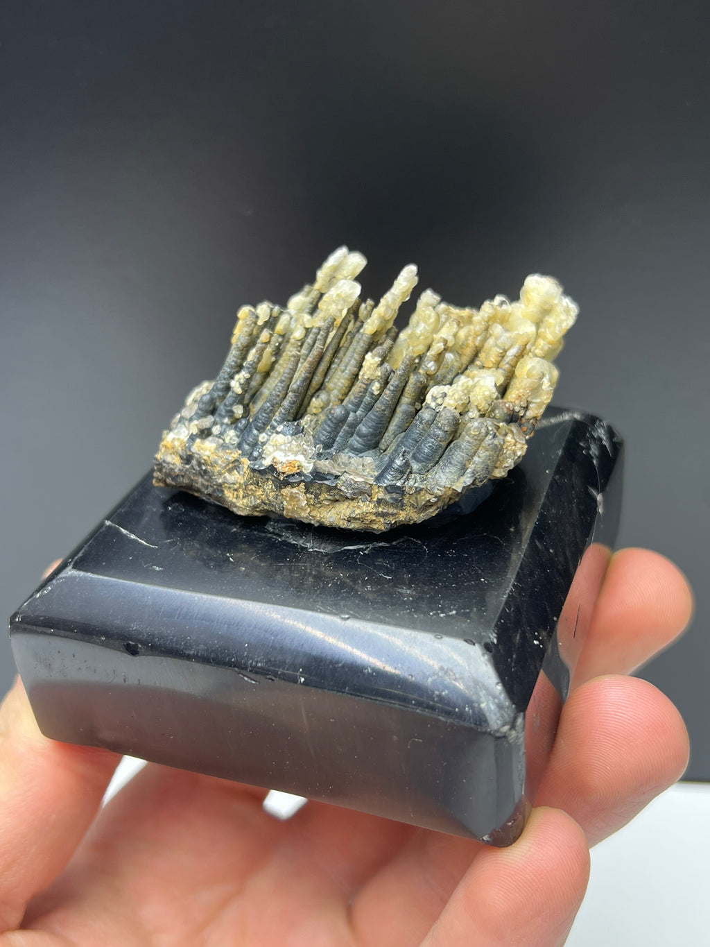 Calcite With Stalactite Goethite On Obsidian Stand